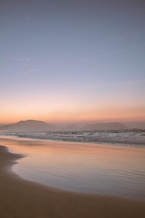 Photo of a Beach During Dusk