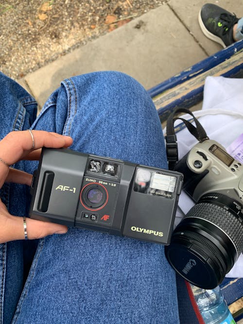 Man Holding a Film Camera 