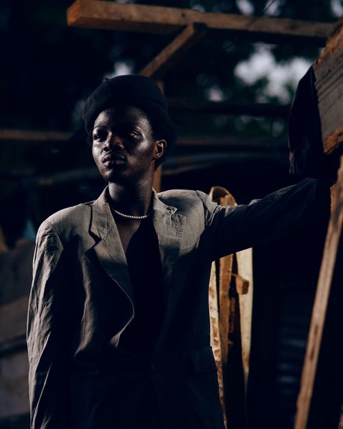 Free Portrait of a man in a gray suit and beanie, posing outdoors in Kumasi, Ghana. Stock Photo