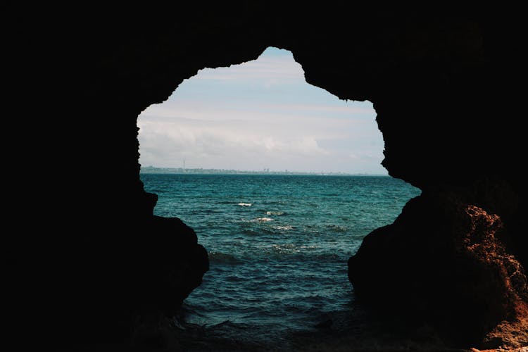 Cave Opening On A Body Of Water