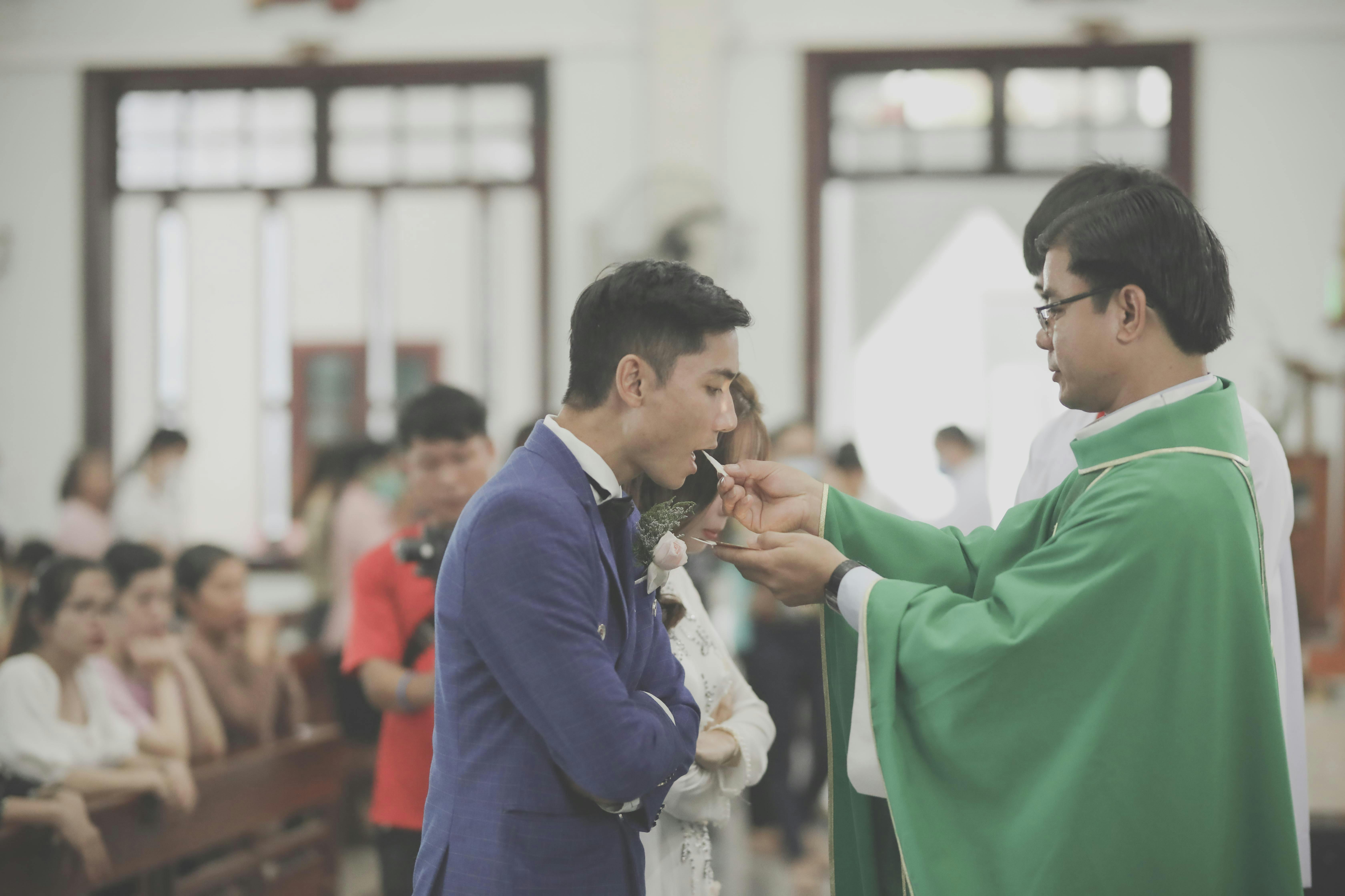 Bride and Bridegroom During Religious Ceremony in a Catholic Church ...
