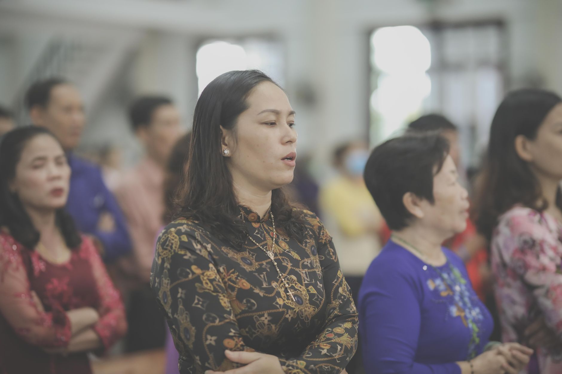 A group of people attentively participating in a church service, embodying community and faith.
