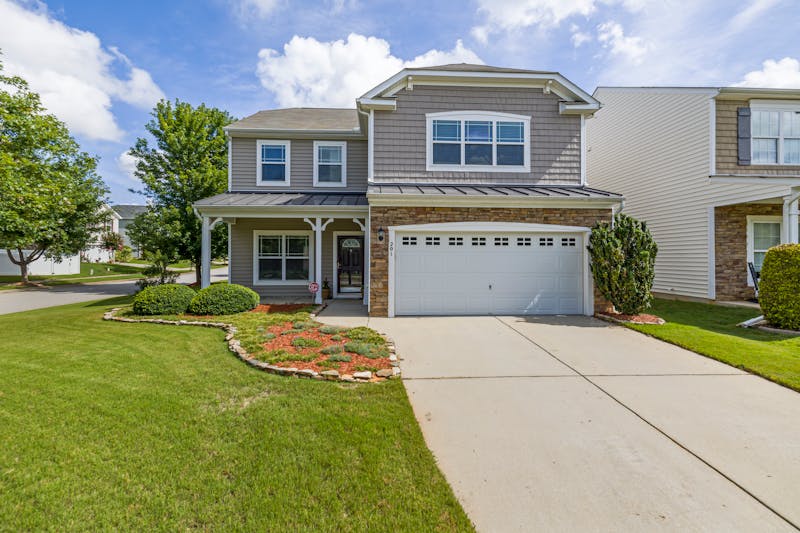 Technician repairing a garage door mechanism
