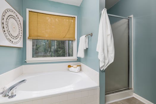 Contemporary bathroom featuring bathtub, shower, and elegant interior design.