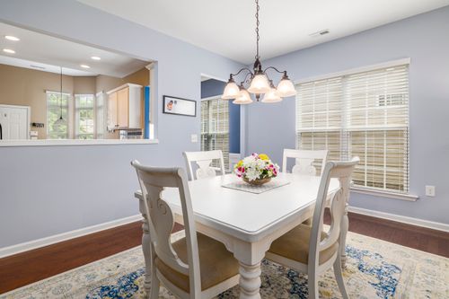 Free Bright and cozy dining room with elegant decor and white furniture. Stock Photo