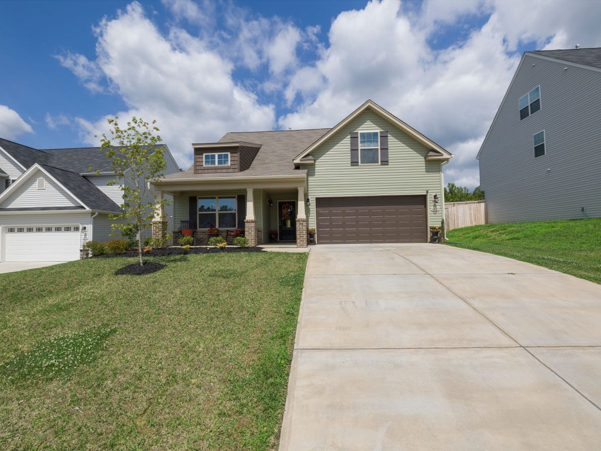 Modern detached suburban home with a wide driveway, typical of the newer Mansfield, TX construction served for pest control