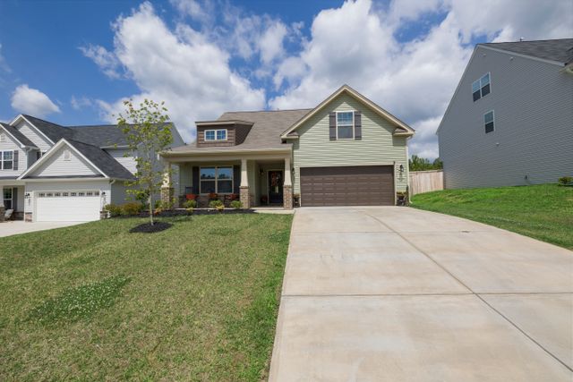 Suburban detached home with driveway, photo by Curtis Adams on Pexels
