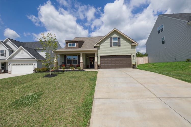 View Of Modern Suburban Detached House With Driveway