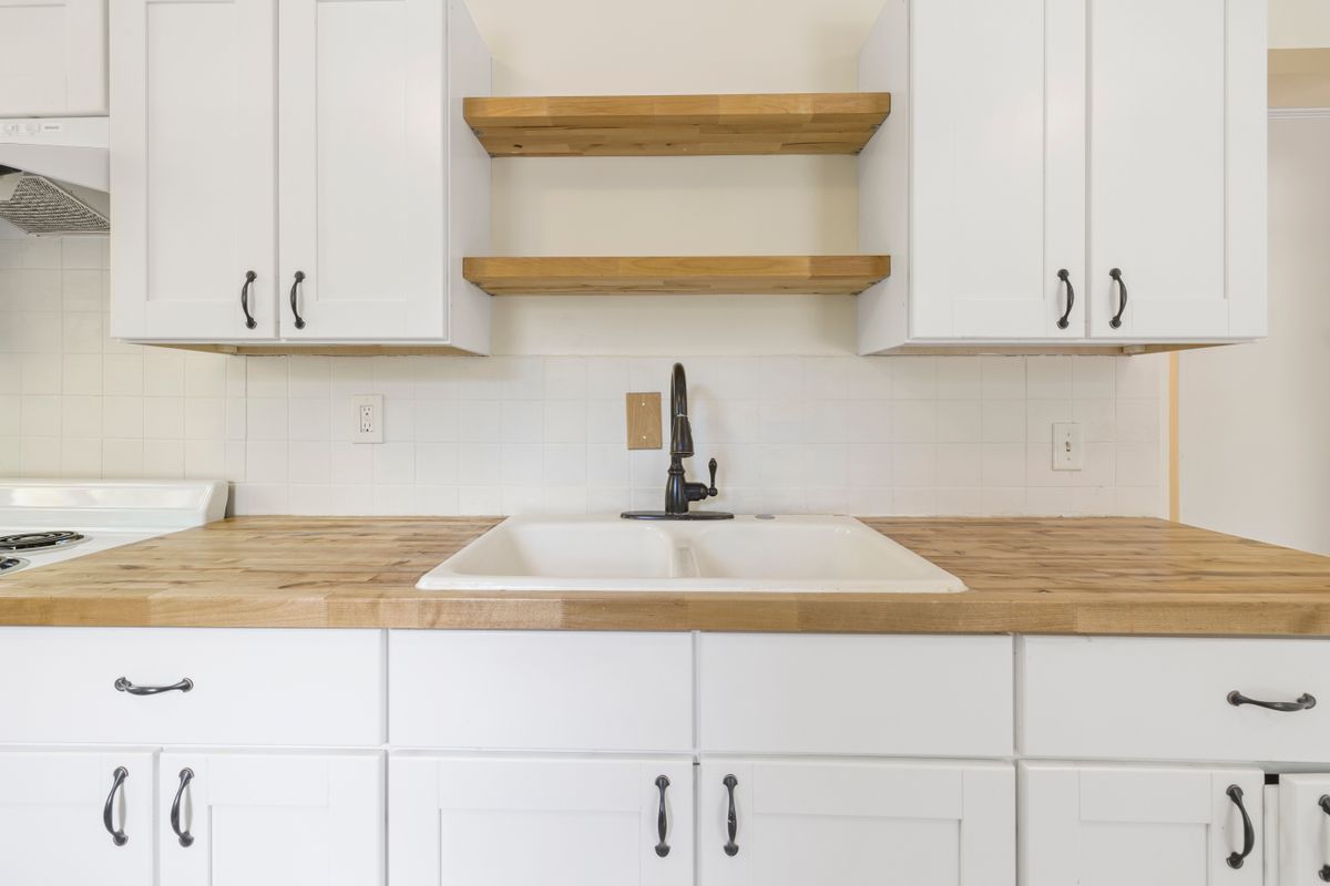 Warm white kitchen with wood accents