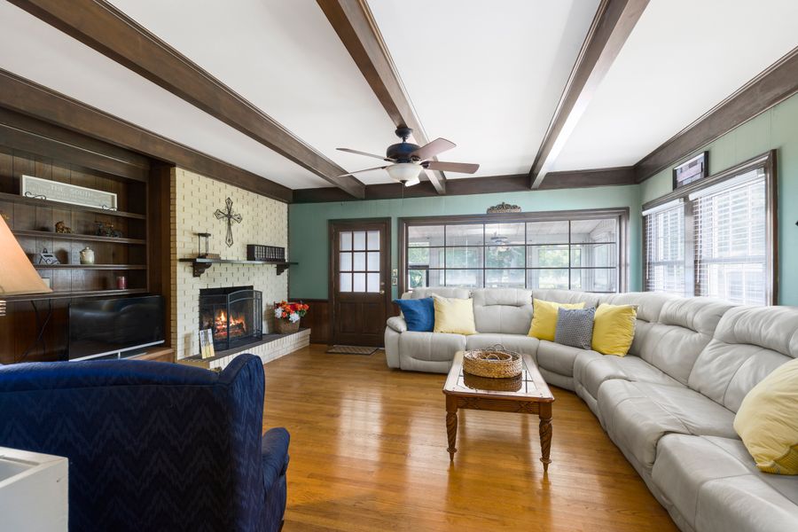 Cozy living room with hardwood floors and fireplace