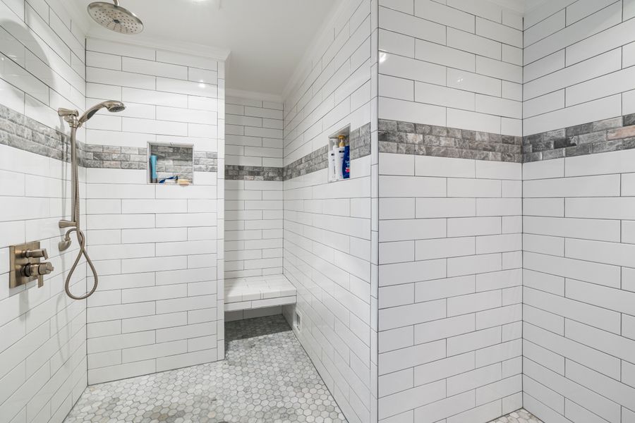 Modern walk-in shower conversion with subway tile built-in bench and rainfall showerhead