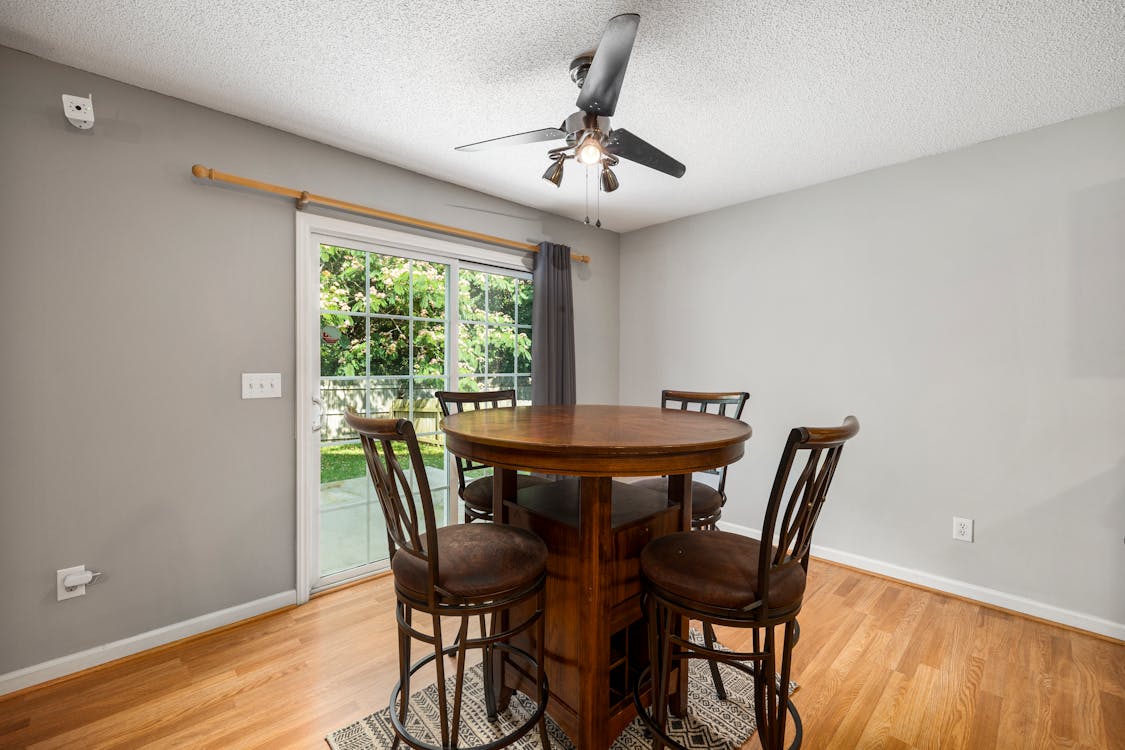 Brown Round Wooden Table and Chairs