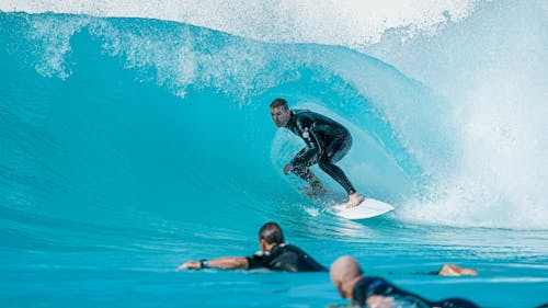 Professional Surfer riding a Surfboard 