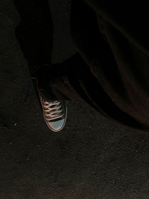 A Person Wearing A Sneaker