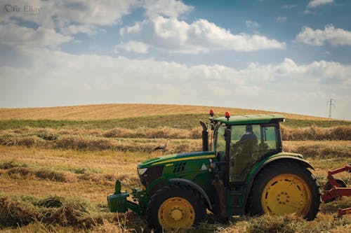 A Green Tractor on a Grass Field