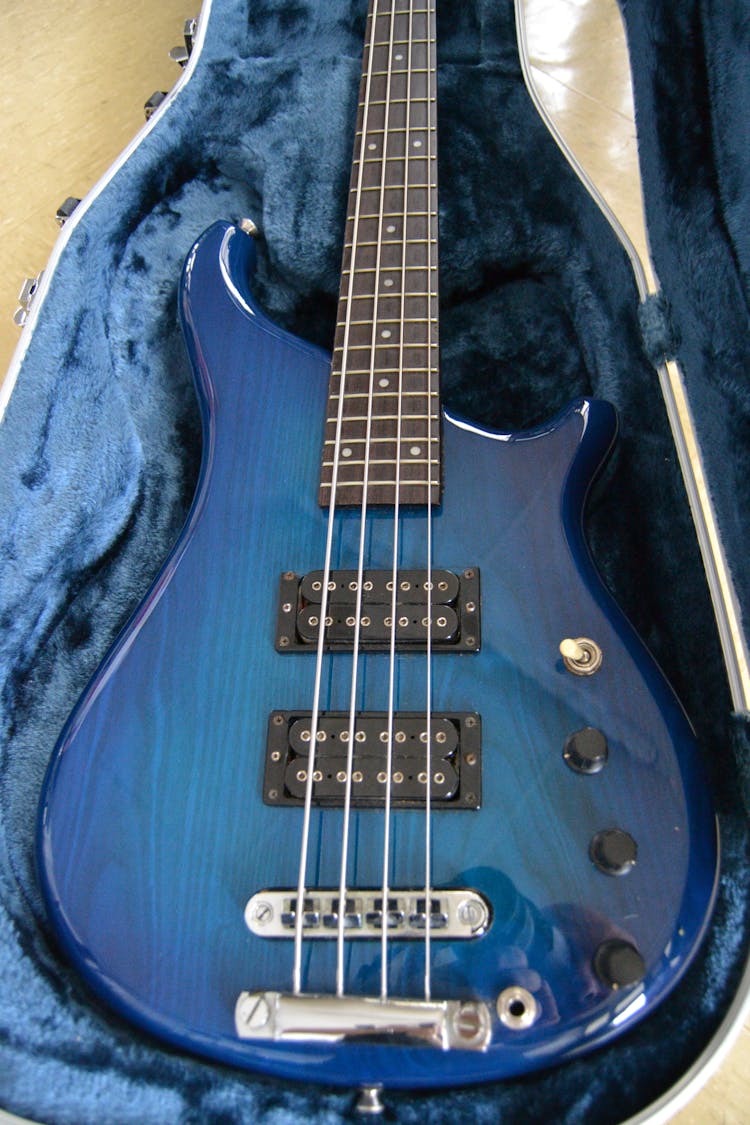 A Blue Electric Guitar In A Case