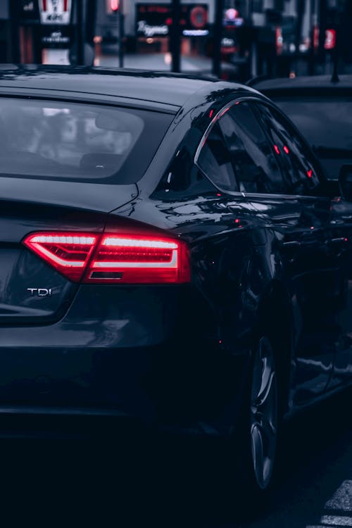 Free A Black Car Traffic on the Road Stock Photo