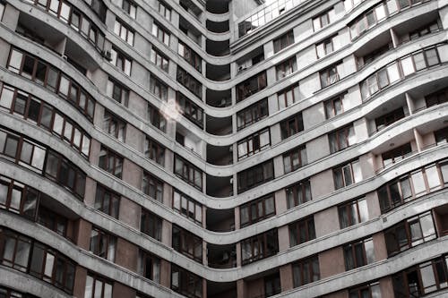  Gray and Brown Concrete Building with Glass Windows