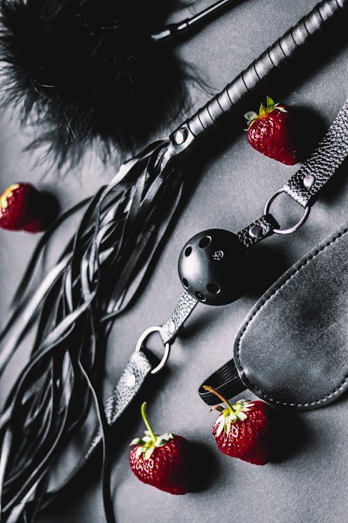 Strawberries Lying Among Leather Erotic Gear