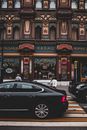 Cars In Front of an Architectural Building