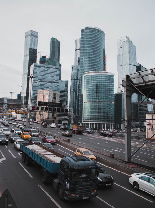 Free Elevated view of cars and trucks amid skyscrapers in bustling Moscow. Stock Photo
