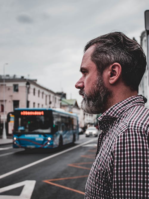 Side View of a Man with Beard on the Sidewalk