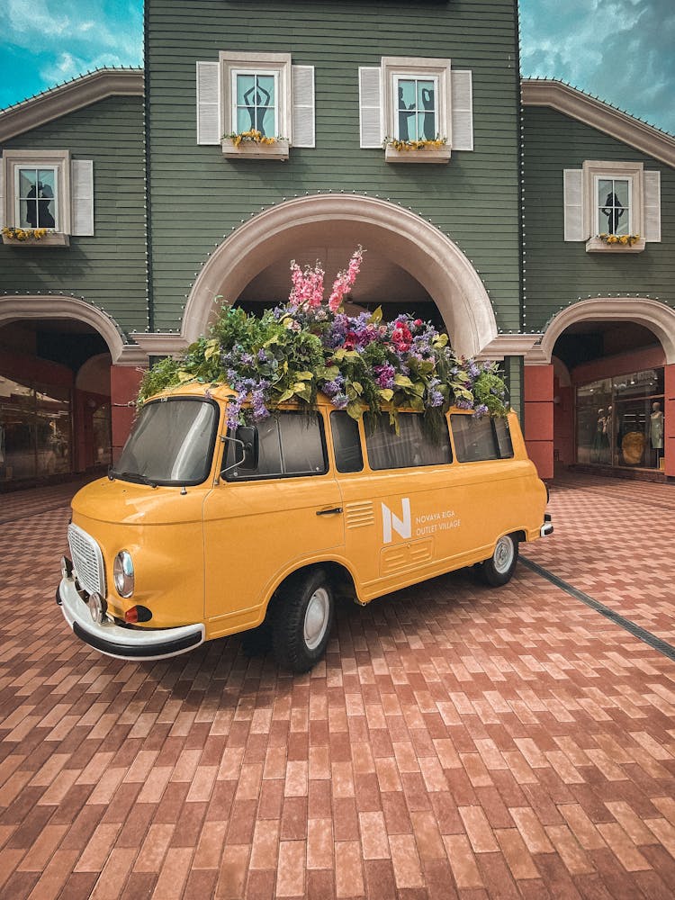 A Vintage Van On A Driveway