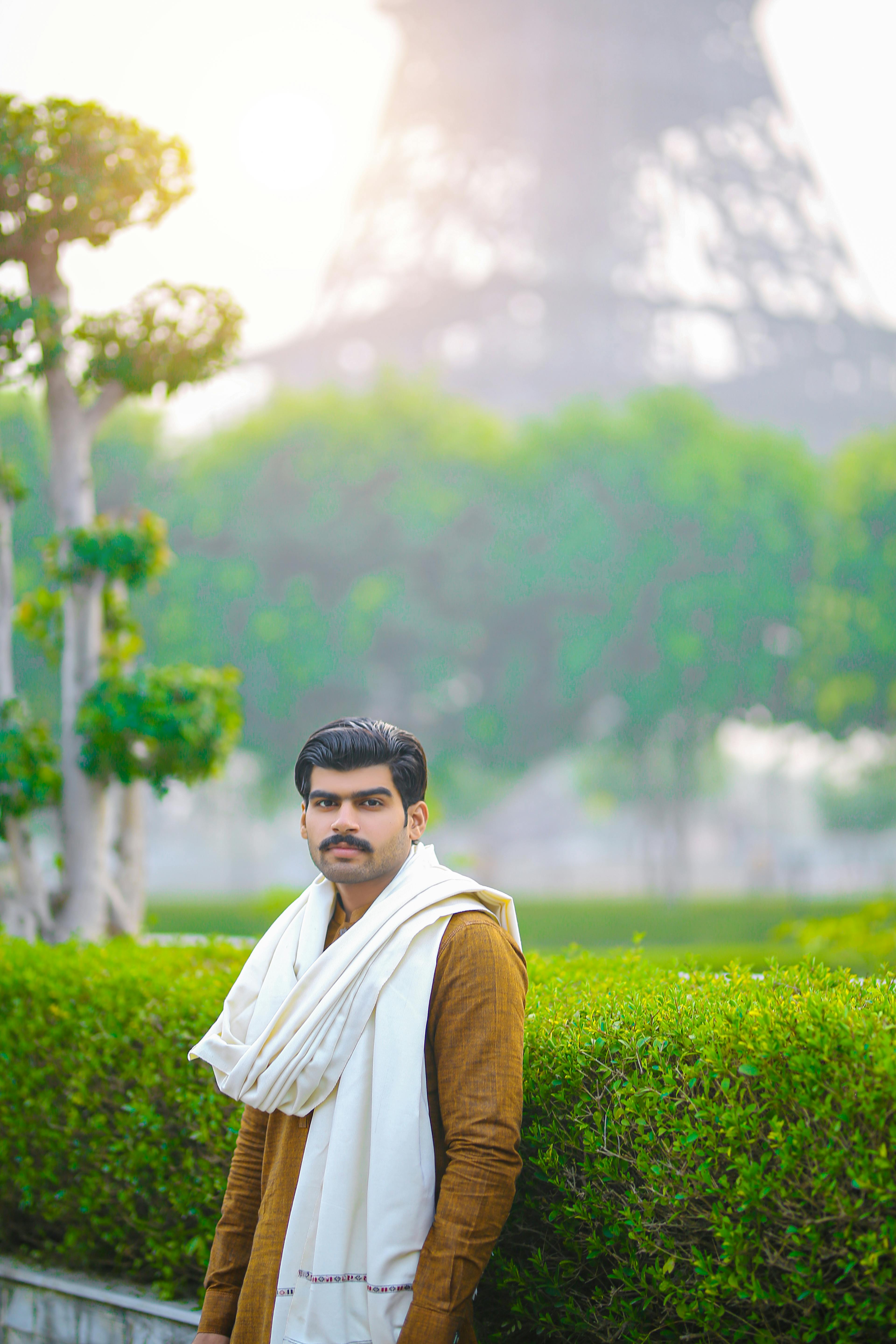 portrait of a man with the eiffel tower in the background