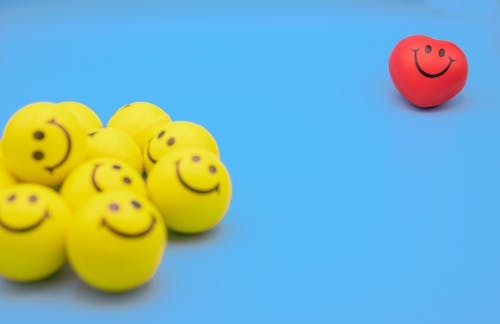Yellow Smiley Emoticon on Blue Surface 