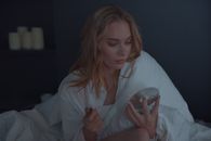 Woman in White Button Up Shirt Holding Clear Drinking Glass