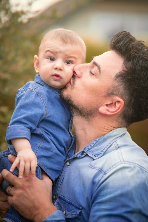 Free Father Kissing his Son Stock Photo
