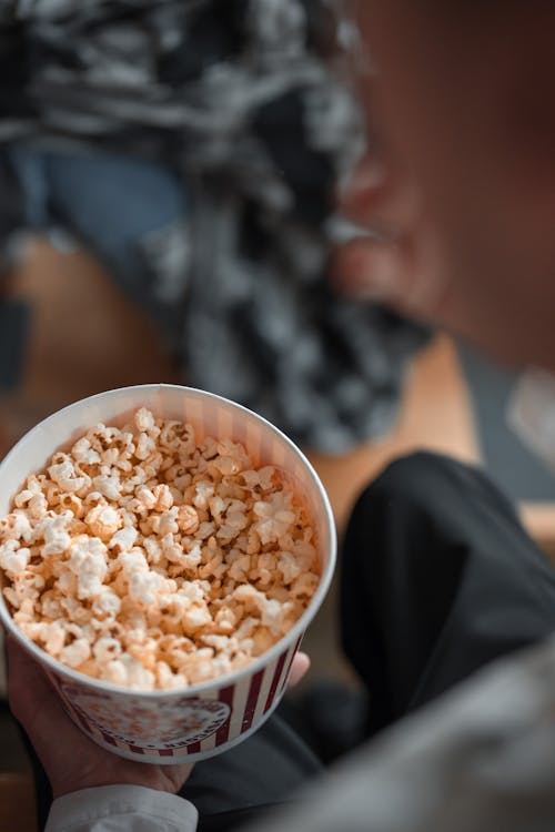 Free Person Holding a Bucket of Popcorn Stock Photo