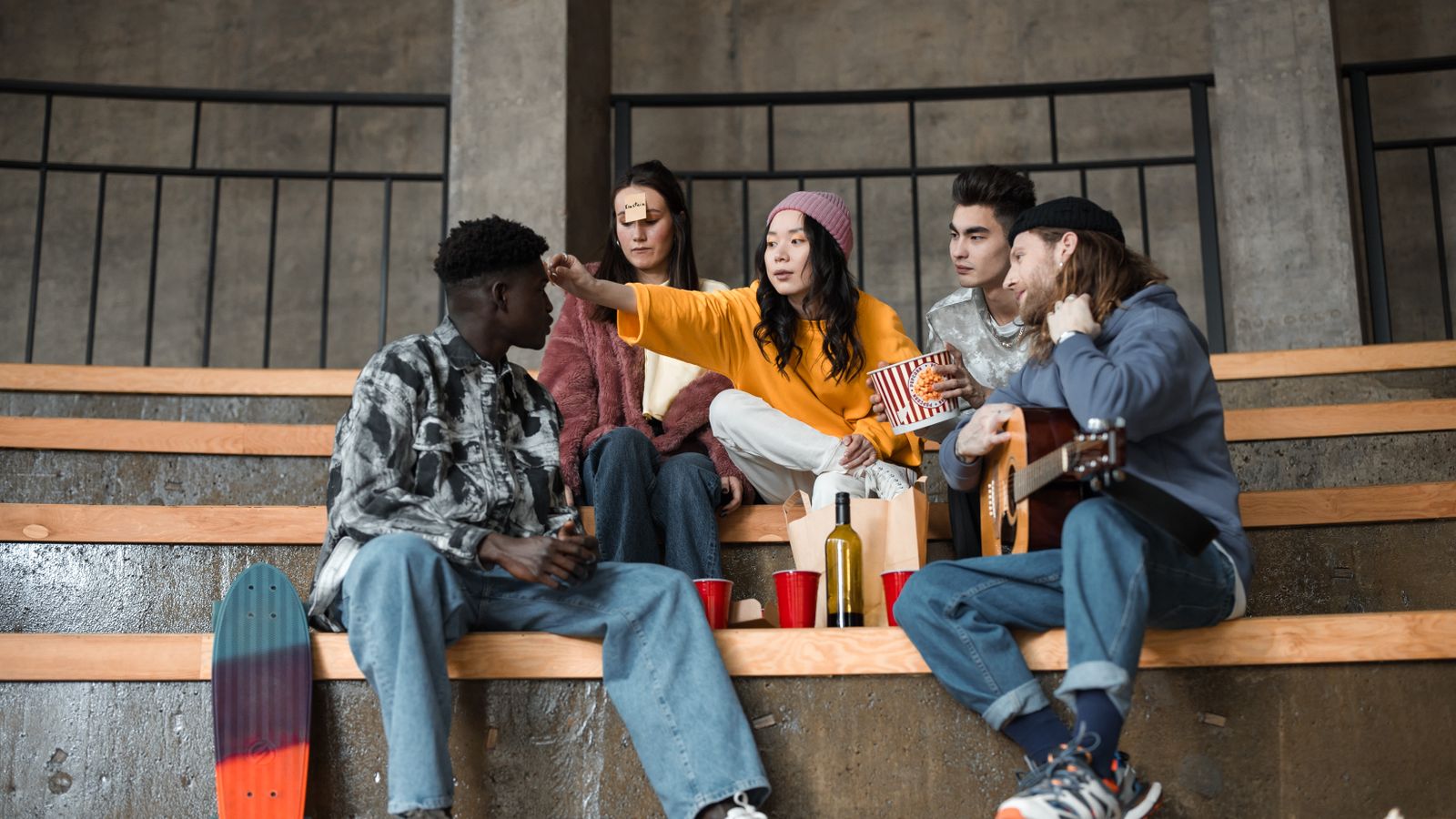 Group of friends playing games together on a sofa