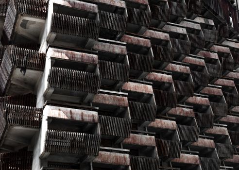Explore the intricate patterns of a weathered brutalist building facade in Dombay, Russia. — photo by Alexey Wineman