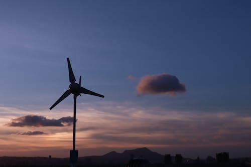 Free Silhouette of a Windmill during Sunset Stock Photo