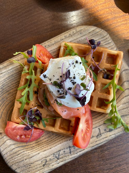 Free Plate of Waffles with Sour Cream and Tomatoes Stock Photo