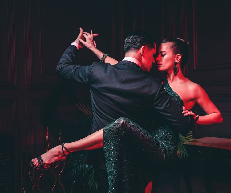 Couple in an abrazo during a milonga