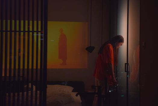 Restless Man leaning his Head against the Door 