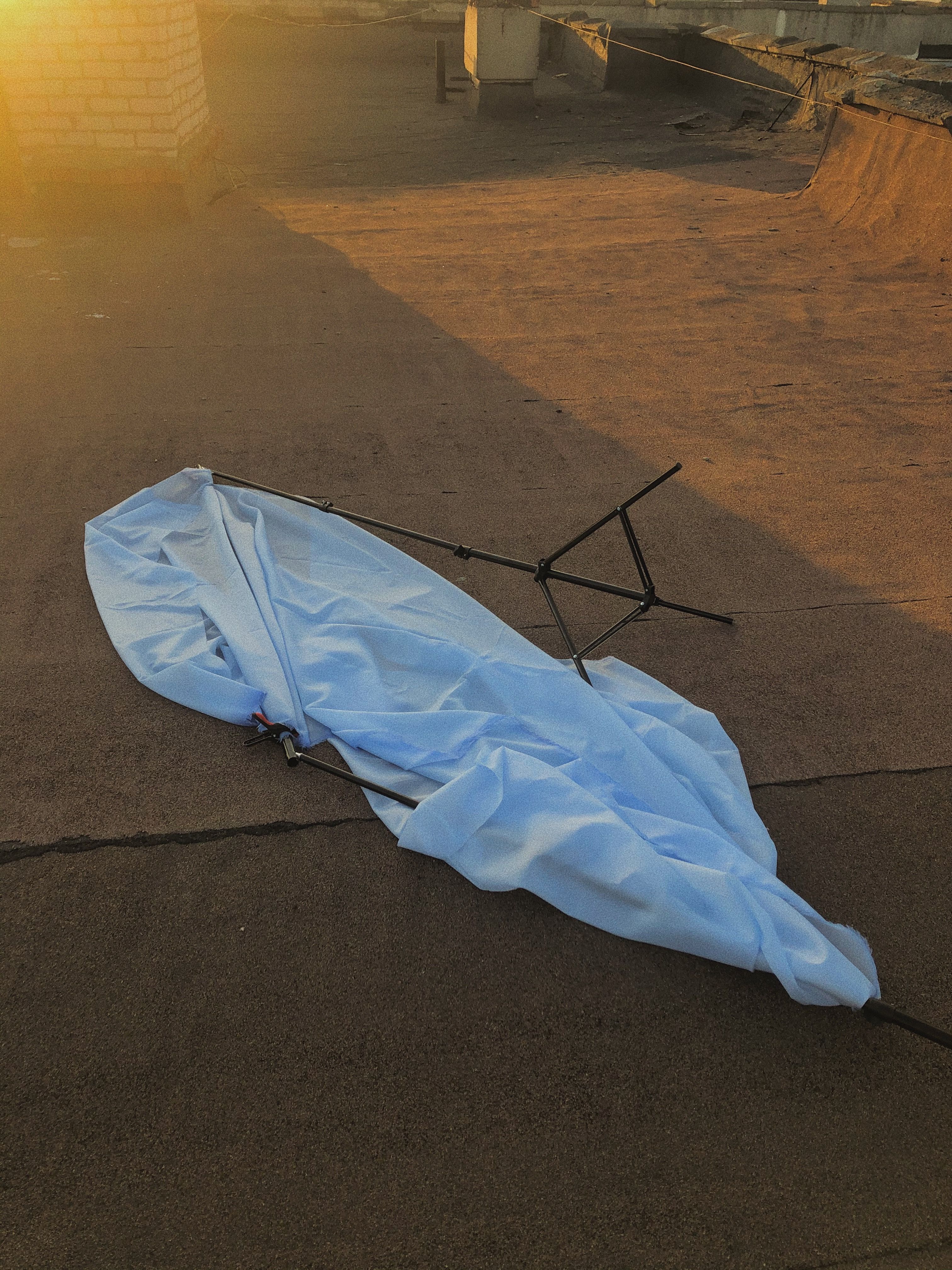 A white cloth and stand on a rooftop during sunset in Biaroza, Belarus.