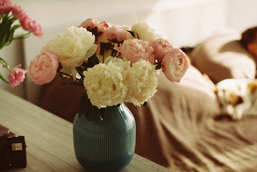 Pink and White Roses in a Green Vase
