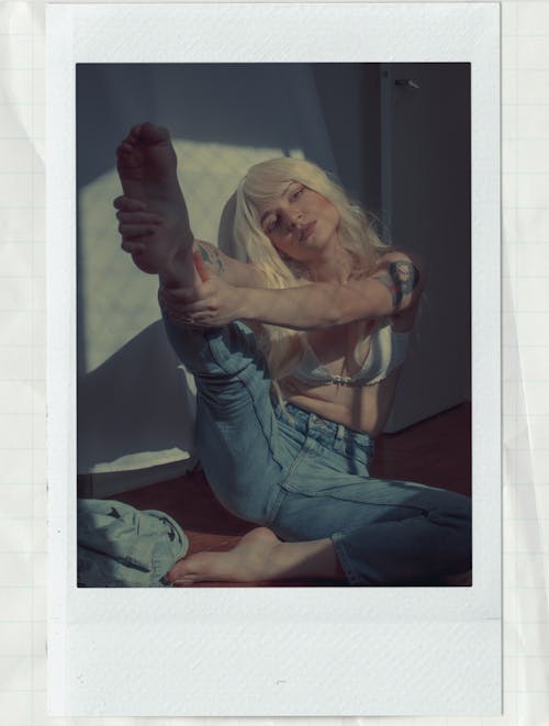 Polaroid Photo of a Woman Raising her Foot