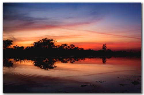 Gratis Fotos de stock gratuitas de ambiente, espectacular puesta de sol, noche Foto de stock