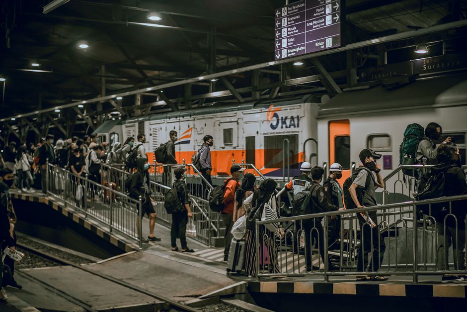 Crowded train platforms with fans waiting for event transit Crowded train platforms with fans waiting for event transit