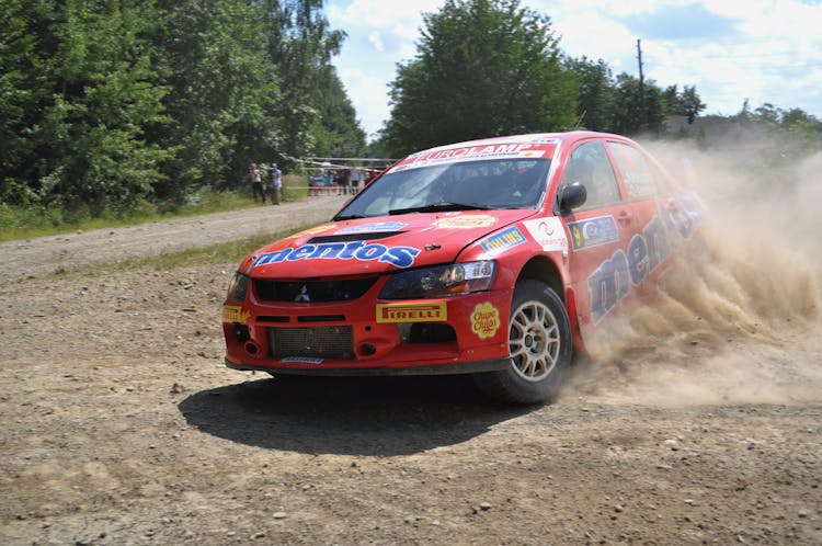 Red Rally Car On Dirt Road