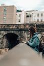 Woman in Denim Jacket Using her Smartphone