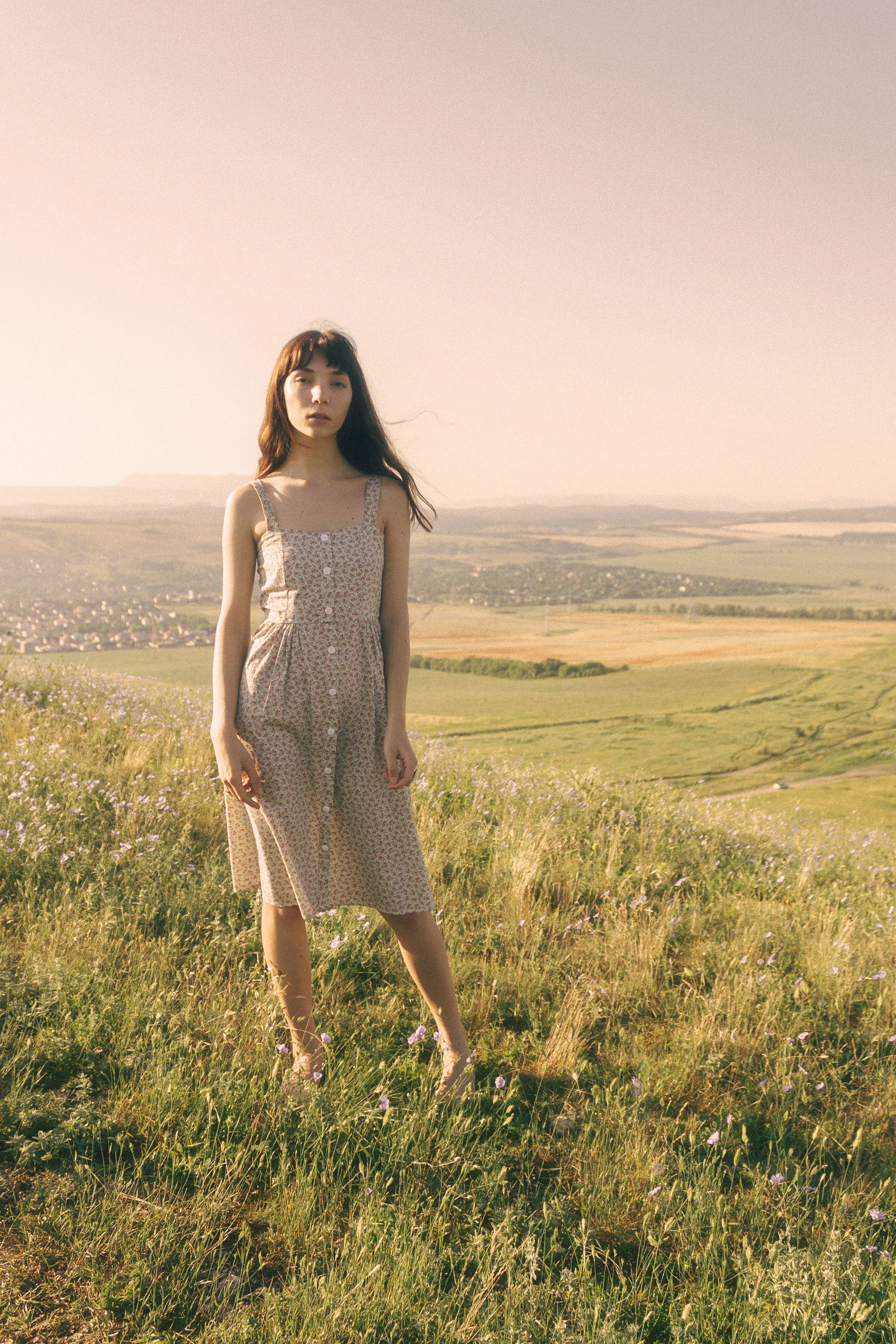 Photo of a Woman in a Dress Standing on Green Grass · Free Stock Photo