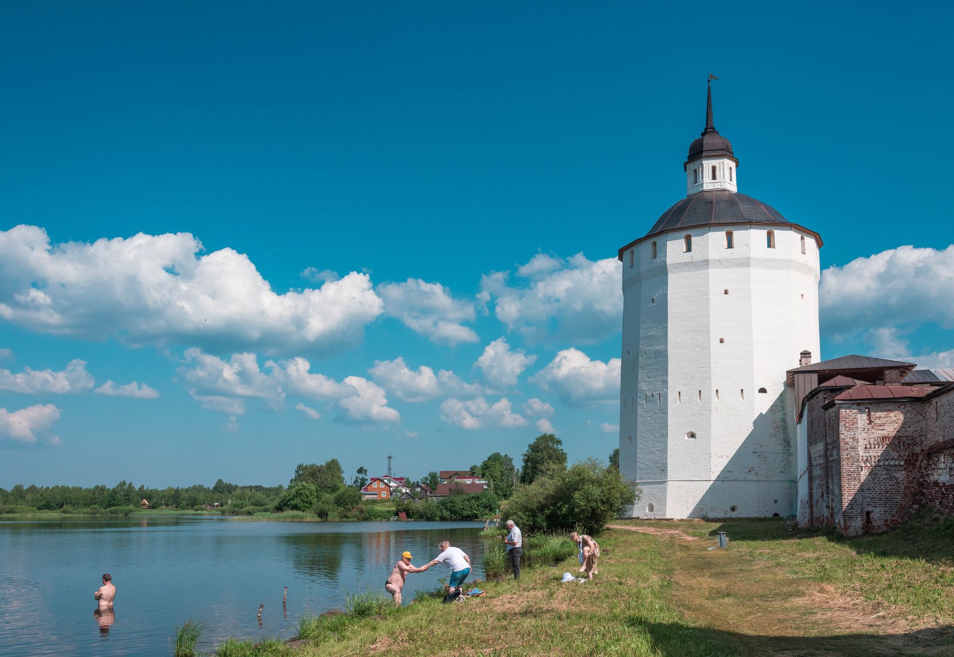 Serene view of Kirillo-Belozersky Monastery beside a tranquil lake in Vologda, Russia.