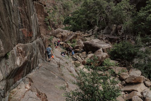 People Climbing on Rocky Mountain