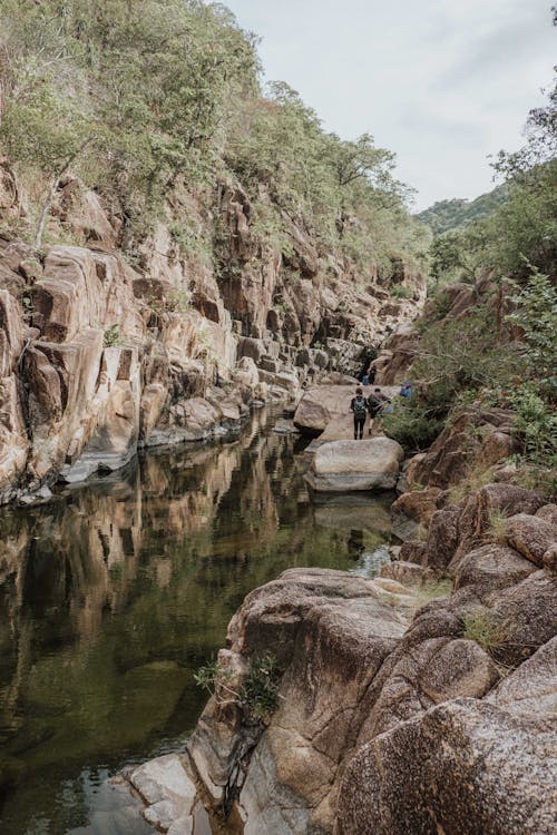 Boulders Around Lake During Daytime