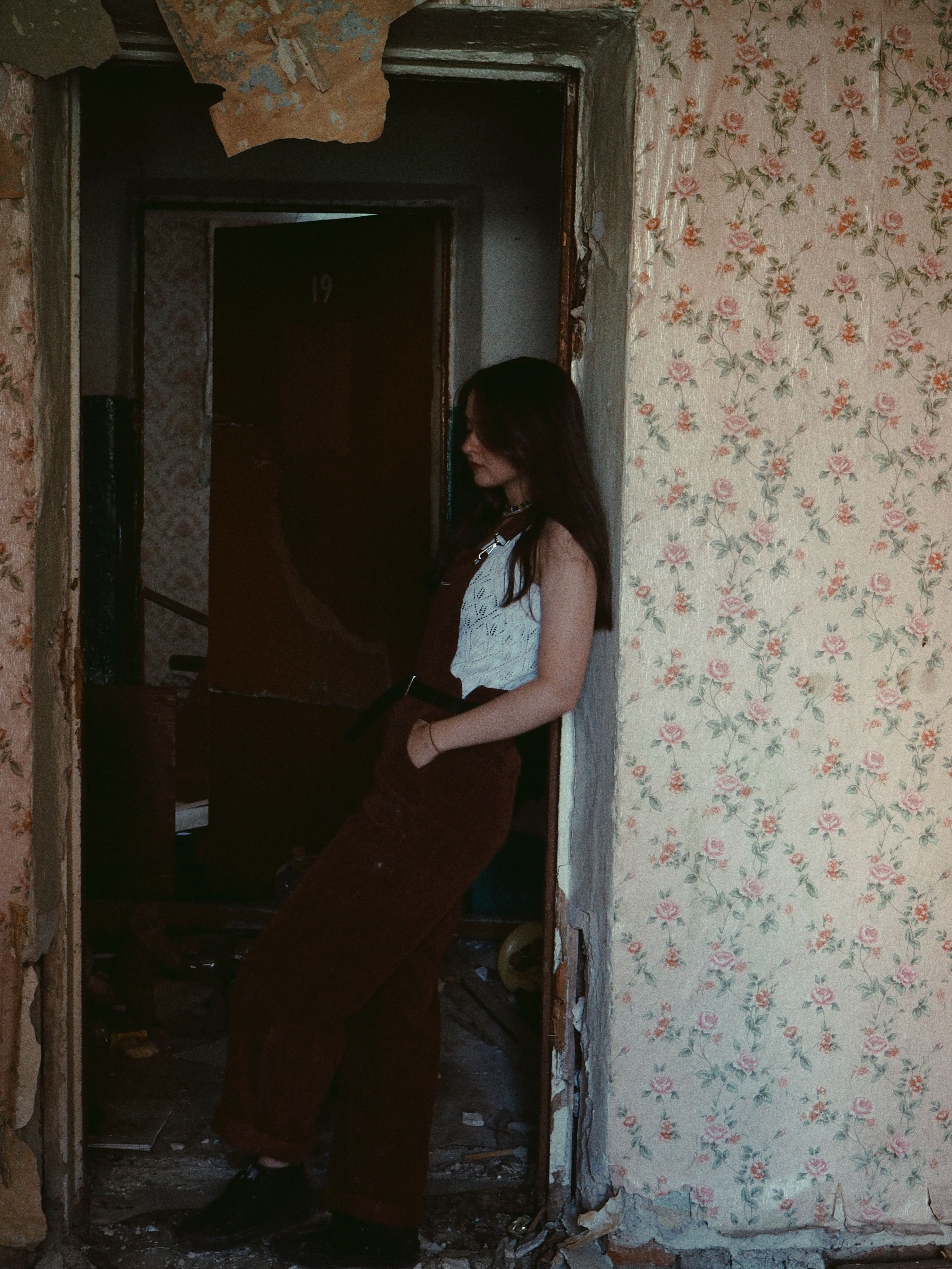Woman Standing in Doorway of Abandoned House · Free Stock Photo